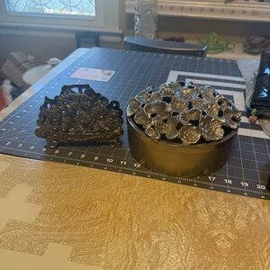 Bundle pewter flower container and silver flower napkin holder.